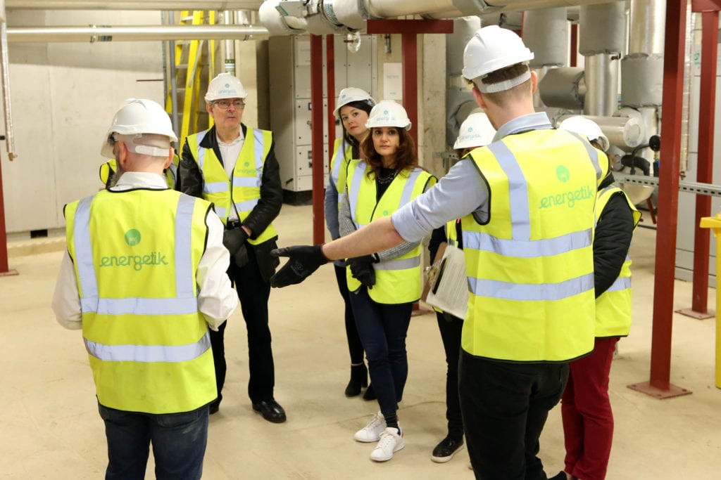 explaining to customers how the heat network works on an energy centre tour